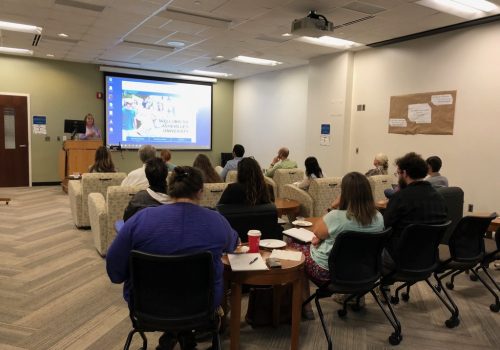 Professors listening to a lecture during an Instructional Technology workshop.