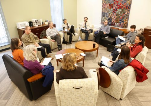 Professors discussing together during a learning circle.